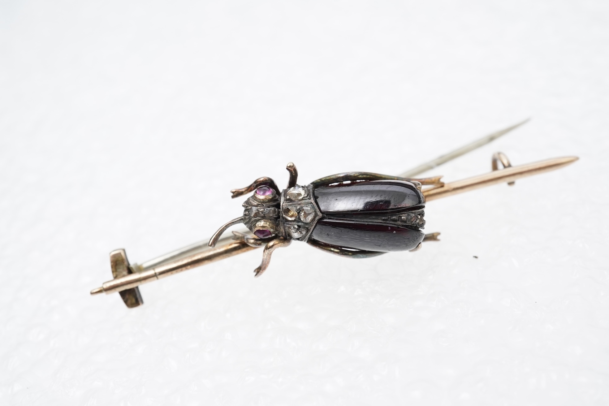 A Victorian garnet and diamond brooch, late 19th century
